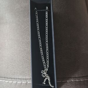 Stainless Dinosaur Pendant Stainless Figuro Necklace.
